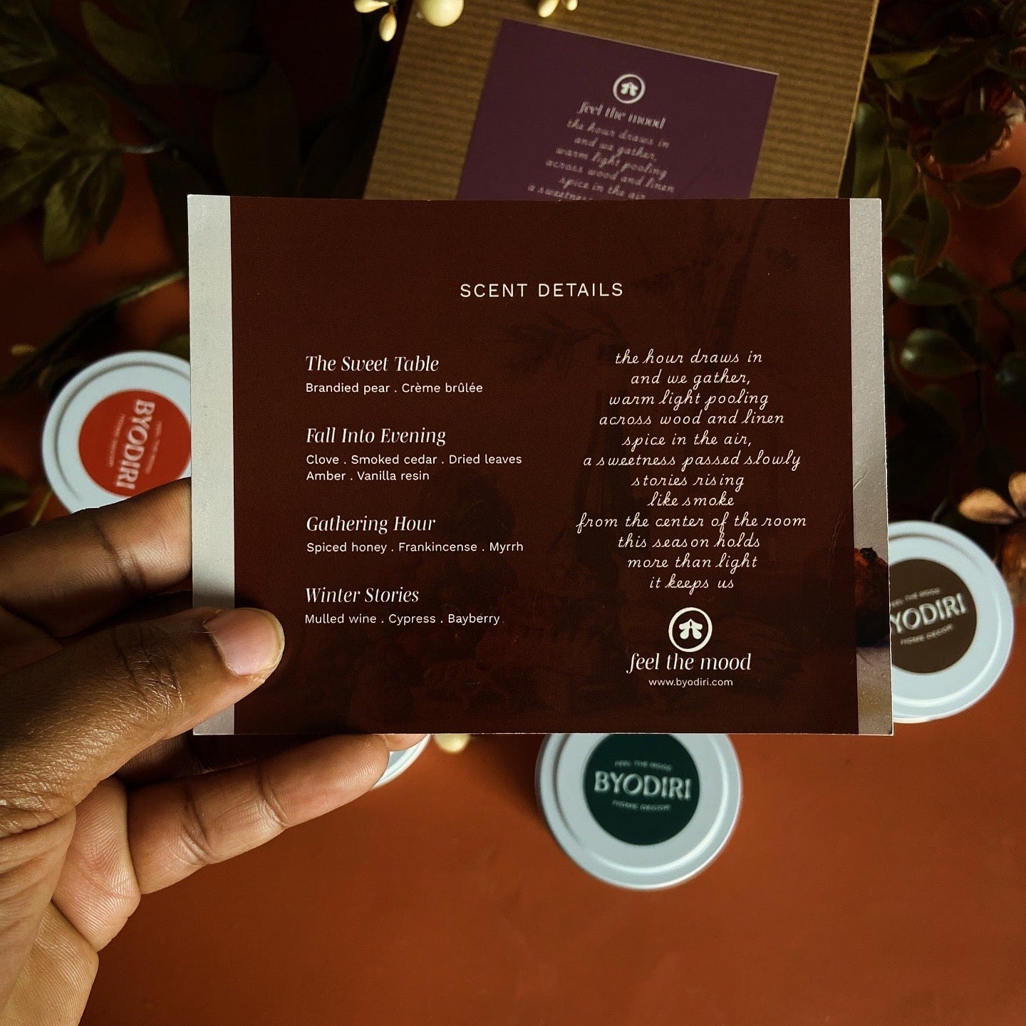 Product packaging with scent details and Byodiri fall and winter candle scent  on a dark background