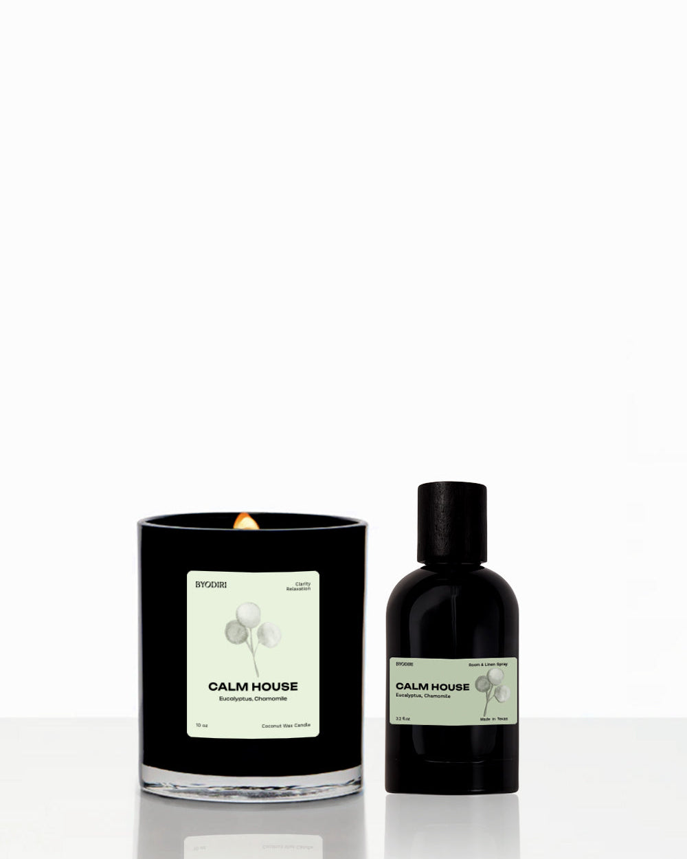 Candle and bottle with 'Calm House' label on a white background