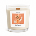 Candle with a 'Bloom' label on a white background