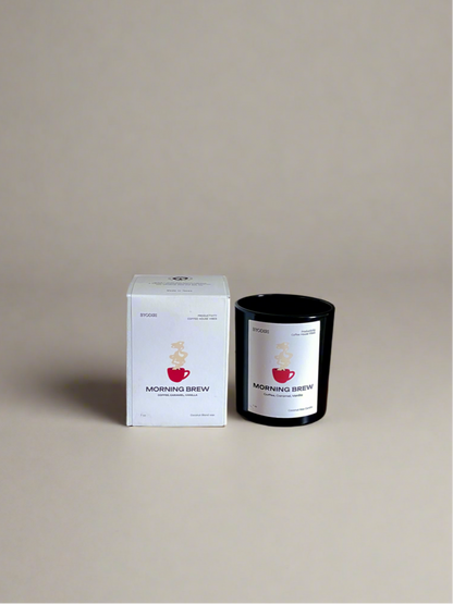 Candle and packaging labeled 'Morning Brew' on a beige background