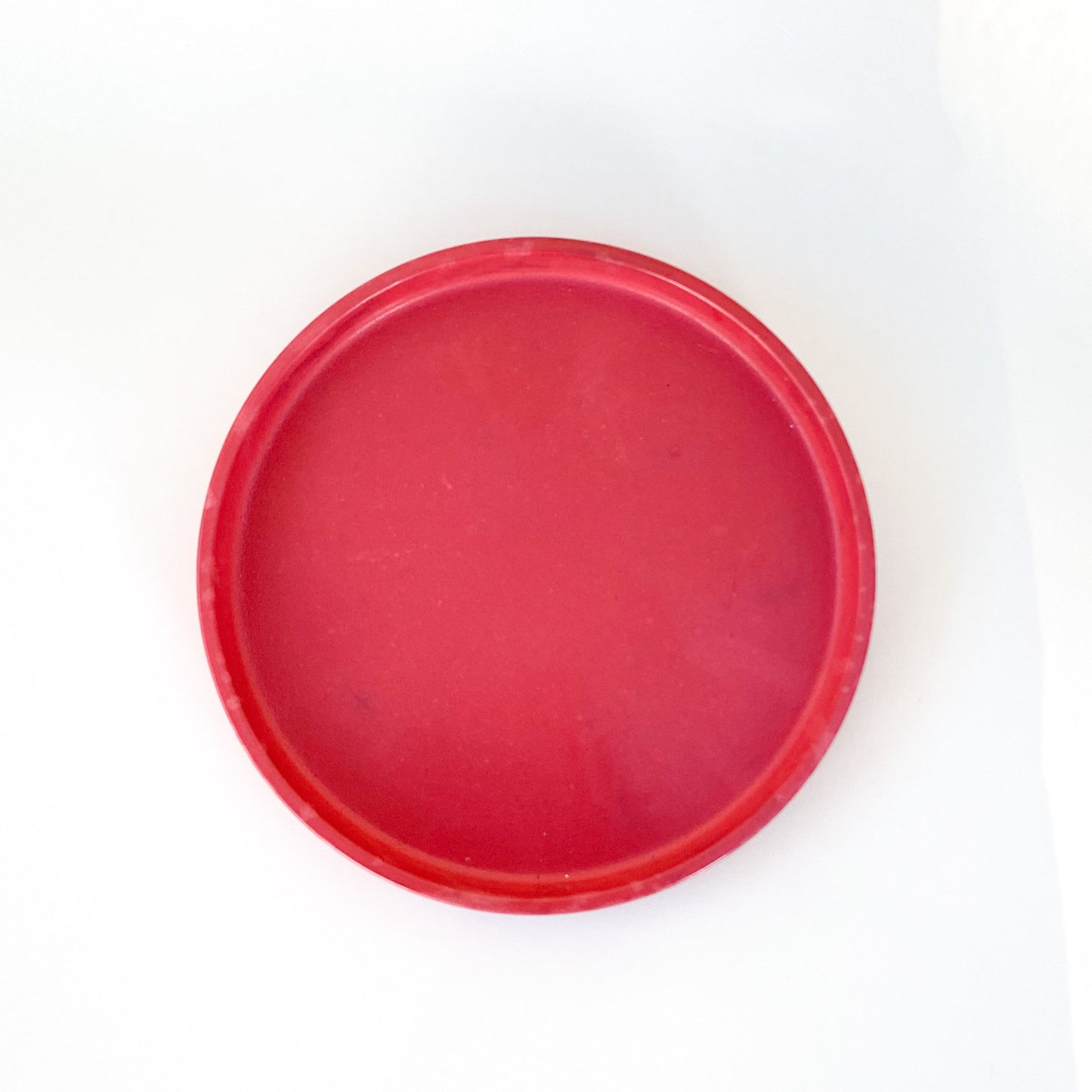 red round catch all tray